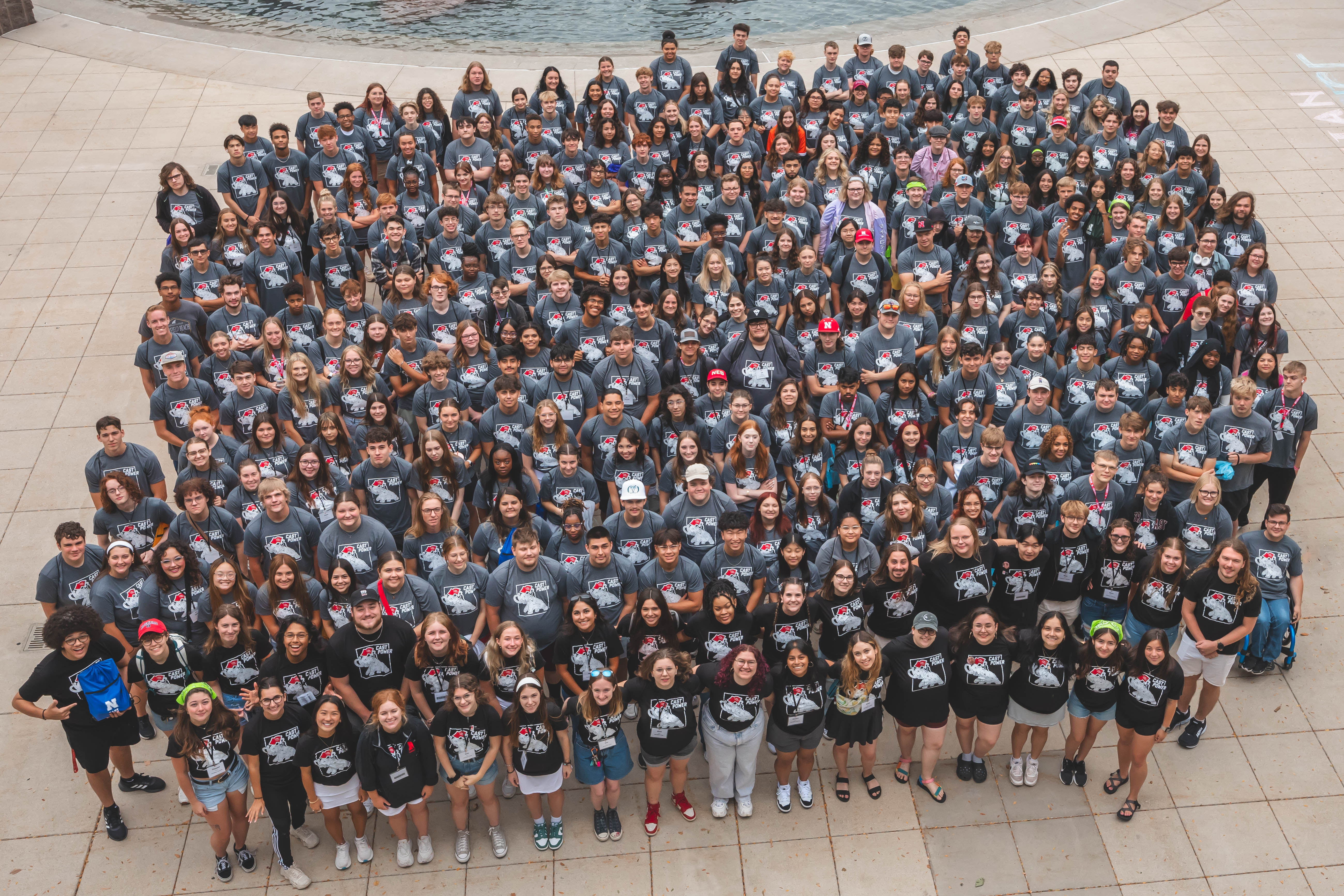 CAST students and staff standing in front of the fountain by the Union. 