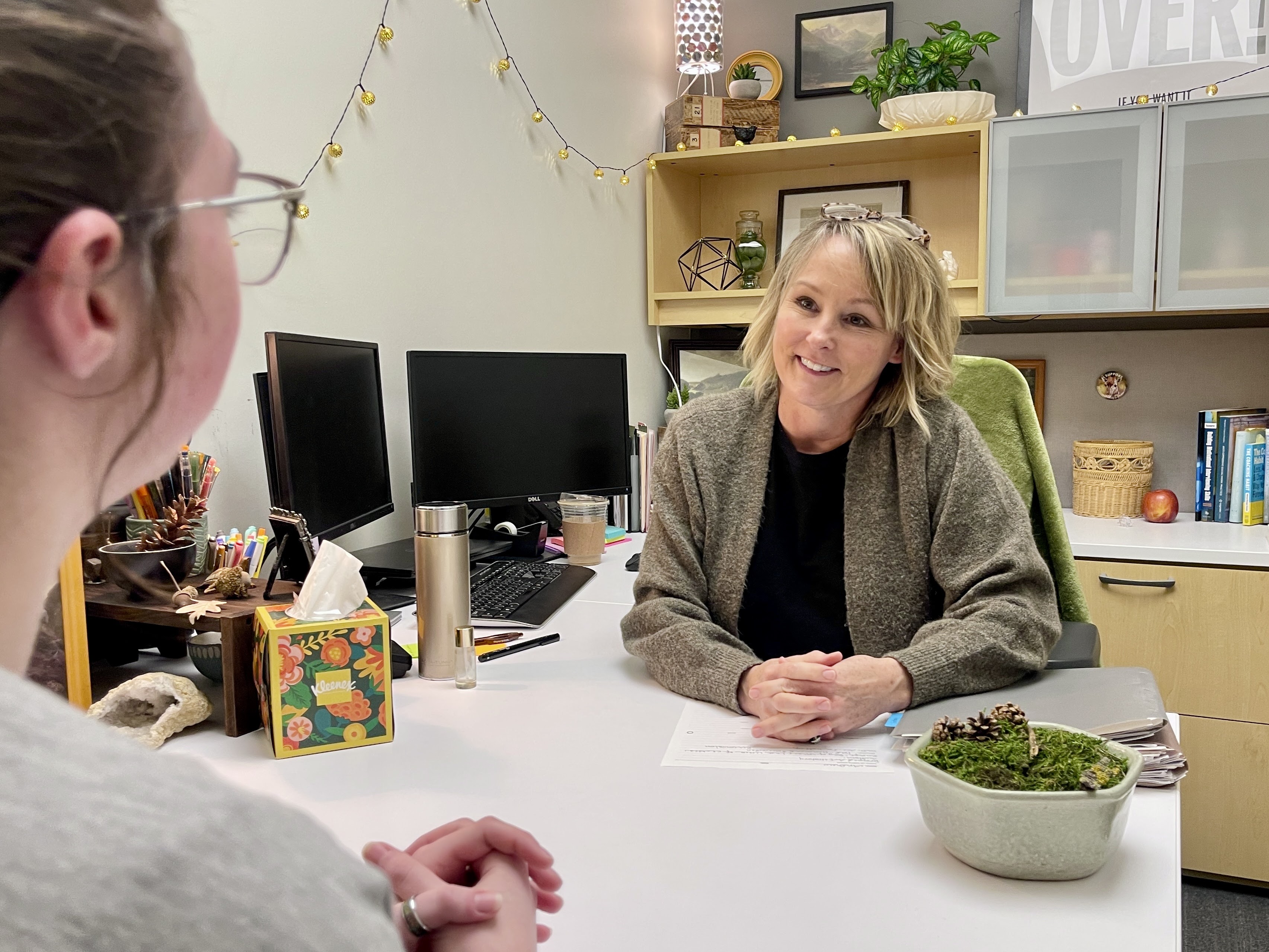 Colleen coaching a student. 