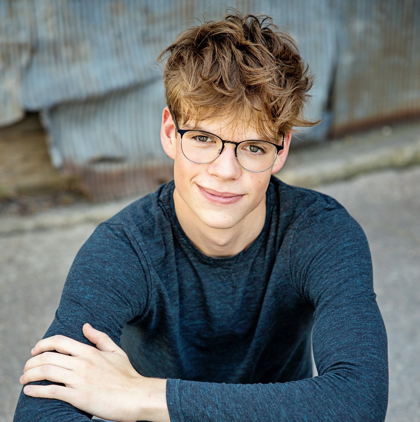 Nate smiling in blue shirt