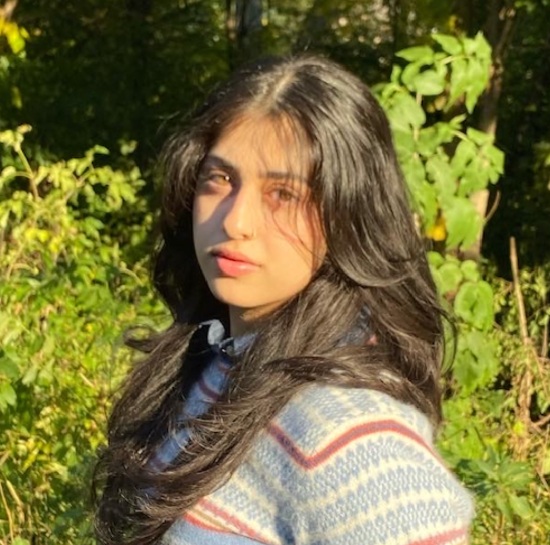 Image of Shrimai in a striped sweater