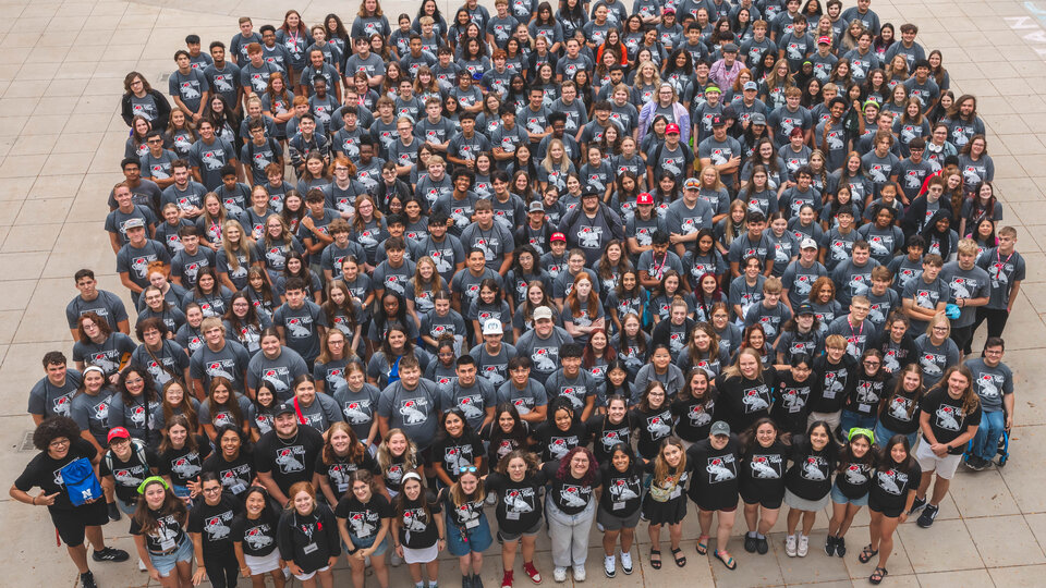 CAST students and staff standing in front of the fountain by the Union. 