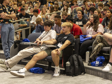 Students sitting in an auditorium.